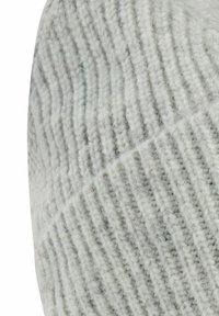 Knitted beanie in light gray with a ribbed texture, featuring horizontal lines and a soft, cozy material.