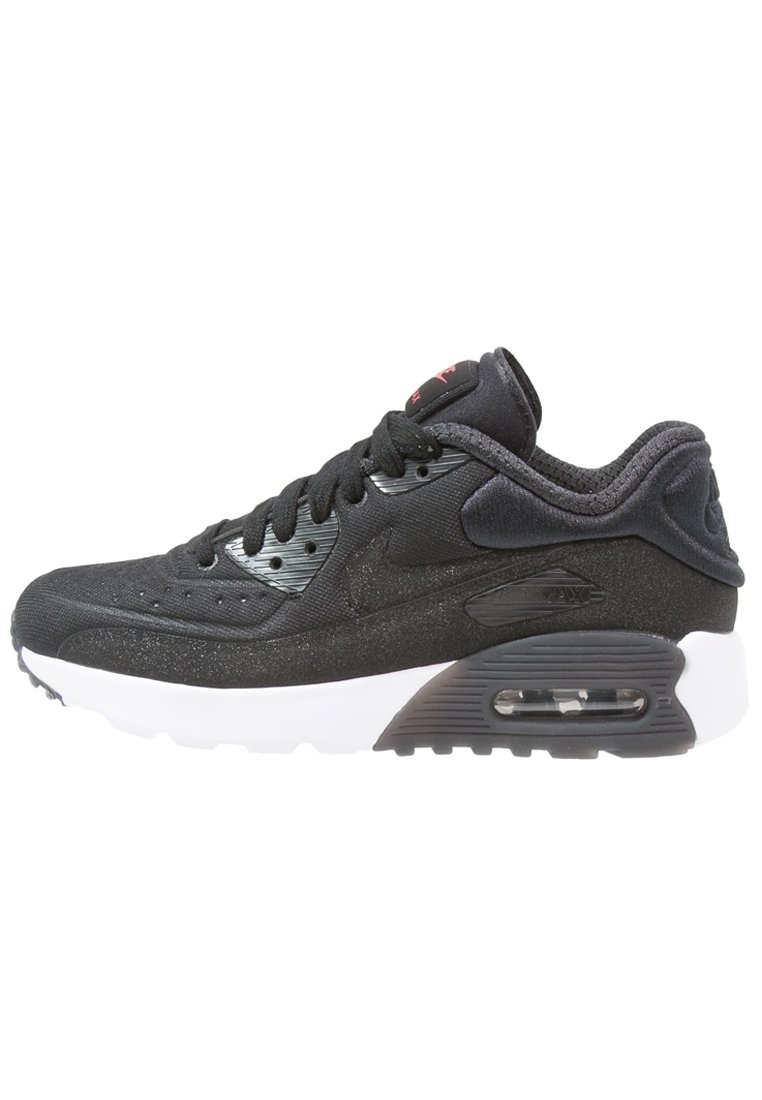 Svart idrottssko med en texturerad ovandel, som har en vit mellansula, nätventilation och Air Max-dämpning. Subtila varumärkesdetaljer synliga.