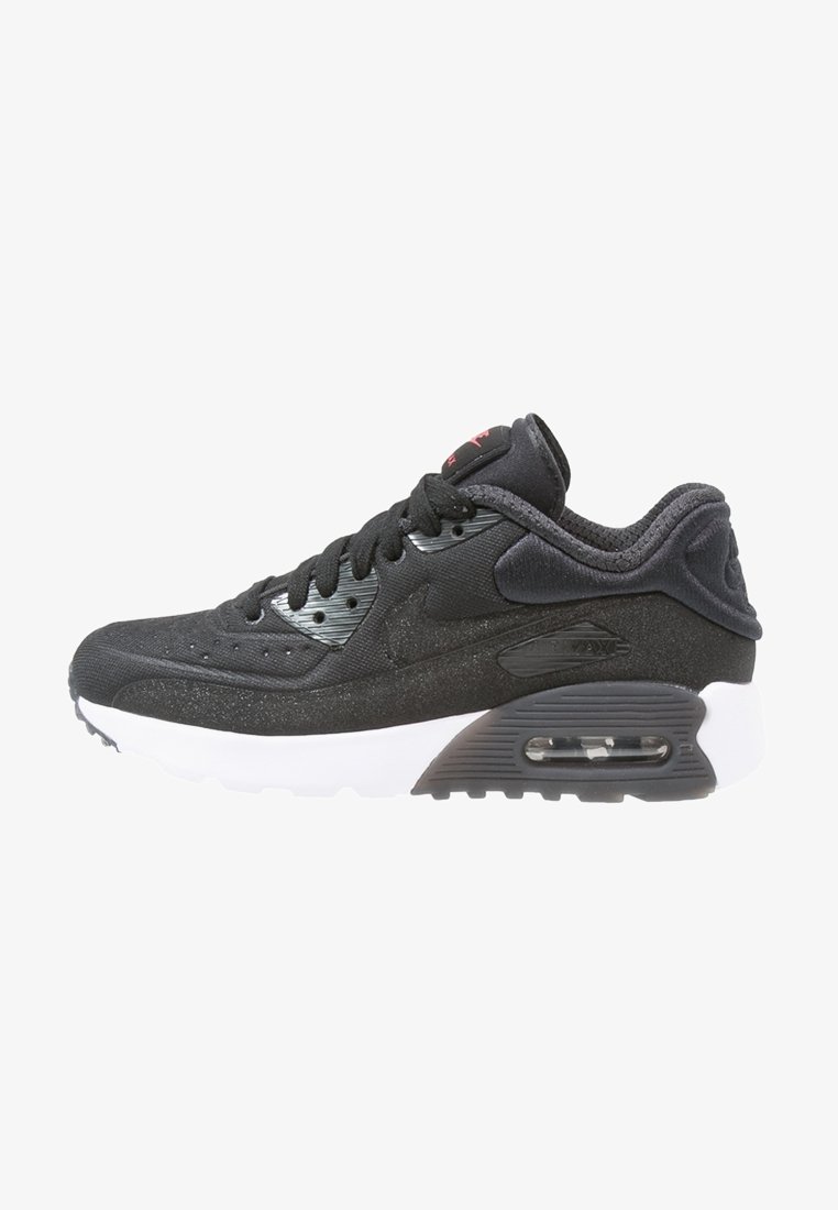 Svart idrottssko med en texturerad ovandel, som har en vit mellansula, nätventilation och Air Max-dämpning. Subtila varumärkesdetaljer synliga.