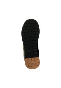 Semelle extérieure en caoutchouc avec surface noire texturée et sections beige. Le motif de la semelle comprend des crampons rectangulaires et circulaires pour l'adhérence.