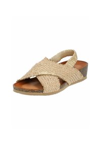 Sandalia de paja tejida en un color beige claro con un tacón bajo en cuña, que presenta un diseño de tiras cruzadas y puntera abierta.