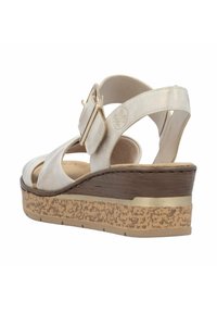 Wedge sandal featuring a light metallic finish, adjustable buckle, open toe design, and textured cork base with wooden accents.