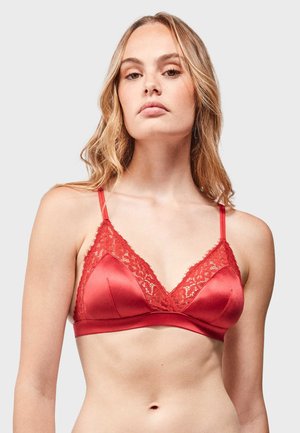 Red satin bralette featuring a lace trim along the neckline and straps, with a smooth texture and triangular cups.