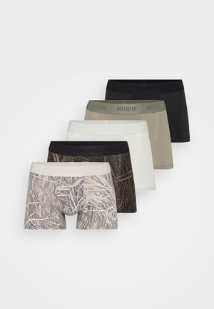 Five pairs of men's boxer briefs in various colors: black, white, light beige, olive green, and a camouflaged pattern. Soft waistband with branding.