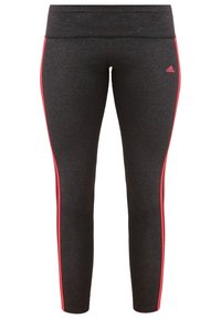 Leggings noirs avec des rayures latérales rouges. Fabriqués à partir d'un tissu extensible et lisse. Dotés d'une coupe ajustée avec une large ceinture élastique.