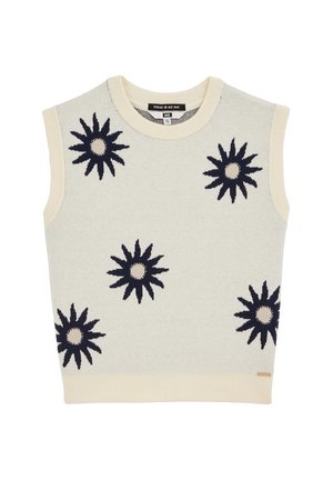 Gilet sans manches en tricot crème avec bords côtelés et cinq grands motifs noirs en forme d'éclat de soleil sur le devant.