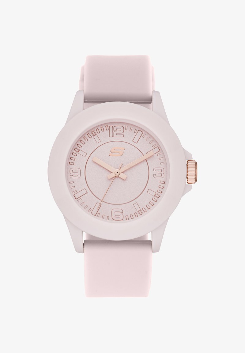 Montre analogique rose avec cadran rond, index et aiguilles en or rose, bracelet en silicone, affichant l'heure 10:10:35.