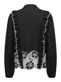 Zwarte blouse met lange mouwen, witte bloemen kanten zoom en verticale geplooide randen met witte omlijning aan de achterkant.
