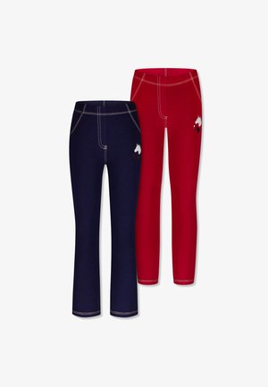 Twee paar legging: één marineblauw met contrasterende stiksels en een unicorn borduursel, de andere rood met vergelijkbare stiksels en ontwerp.