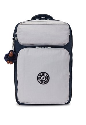 Marinblå och grå tygryggsäck med två fack med dragkedja, rund Kipling-logotypbadge och en apa nyckelringsaccessoar.
