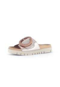 Metallic rose gold slide sandals with a plaited decorative strap, beige cushioned footbed, and a thick white rubber sole with ridges.