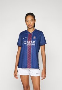 Blue soccer jersey with a geometric pattern in red and white, featuring a V-neck, short sleeves, and "QATAR AIRWAYS" logo on the front.