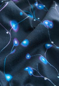Dark fabric with a smooth texture featuring a pattern of glowing blue and purple orbs connected by thin white lines.