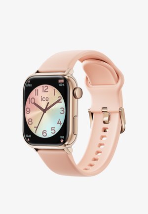 Smartwatch z prostokątną czarną tarczą, pastelowym gradientem na tarczy, złotymi metalowymi akcentami oraz jasnoróżowym silikonowym paskiem z otworami.