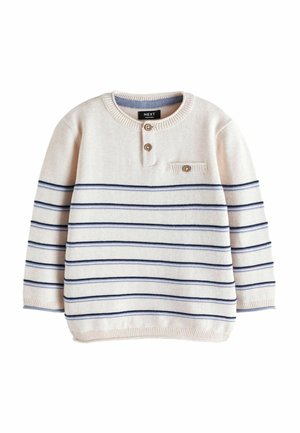 Kremowy sweter dziecięcy z długim rękawem, ozdobiony granatowymi poziomymi paskami, z dwoma drewnianymi guzikami przy szyi oraz małą kieszonką na piersi zapinaną na guzik.
