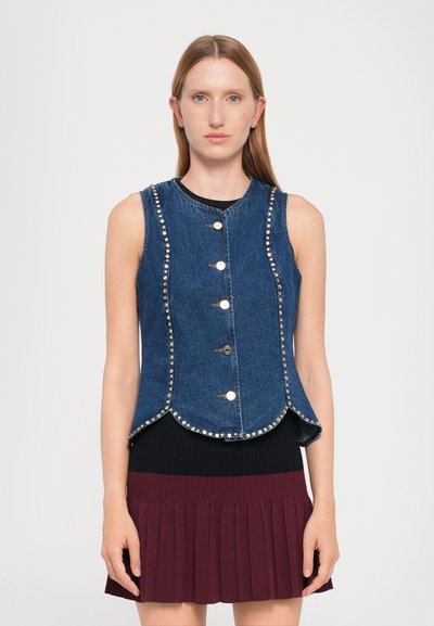 Denim vest featuring a fitted design, round neckline, and notable silver stud detailing along the edges. Five button closures at the front.
