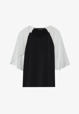 Sort og hvid kortærmet top med en afslappet pasform. Har en rund halsudskæring og lagdelt stof i kontrastfarver. Glat tekstur.