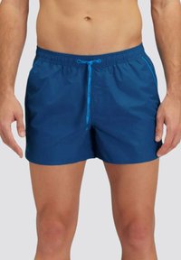 Costumi da bagno blu realizzati in materiale leggero, con una vita elastica, cordino e tasche laterali con cuciture a contrasto.