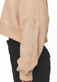 Pegador Felpa - sand