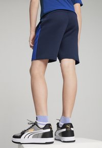 Puma EVOSTRIPE - Teplákové kalhoty - club navy
