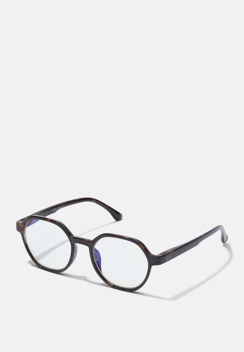 Brown tortoiseshell eyeglasses with octagonal frames, clear lenses, and a smooth finish. Features sturdy, tapered arms with logo detail.