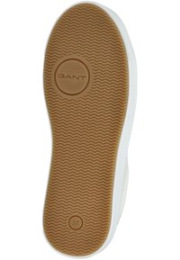 Podeszwa z gumy w wzór kompozytowy, w kolorze beżowym, z białym wykończeniem po bokach. W centralnej części znajduje się logo GANT, a rozmiar oznaczony jako 37.