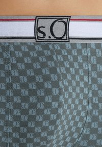Gray boxer briefs featuring a checkerboard pattern in light blue, with a white waistband accented by horizontal red and black stripes.