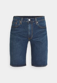 Džínové šortky v tmavě modré barvě se rovně střih. Mají zapínání na knoflík, pět kapes a viditelné švy v kontrastní oranžové barvě.