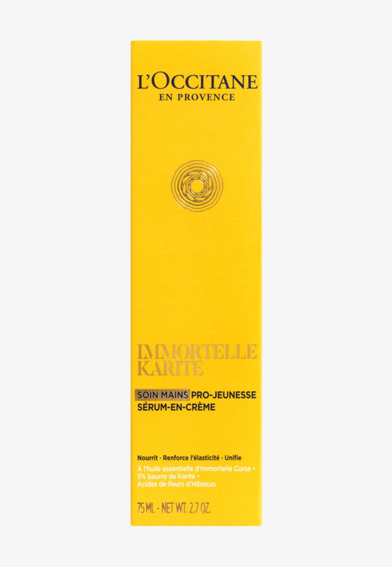 Boîte du sérum crème pour les mains L'Occitane Immortelle Karité, jaune avec texte noir et doré, 75 ml, détails du produit en français et en anglais.