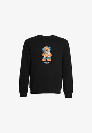 Sweatshirt noir avec un motif d'ours en peluche souriant, entouré de gouttes bleues et du texte "MILW", en tissu doux.