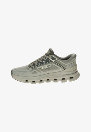 Light gray Skechers running shoe with mesh upper, cushioned sole featuring oval cutouts, and "SKECHERS ENGINEERED" branding on the side.