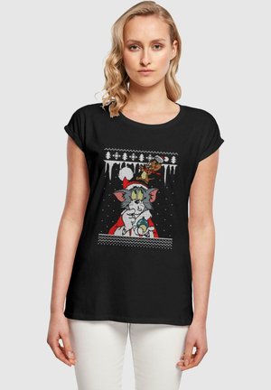 Sort bomulds t-shirt med et tegneseriegraphic af Tom og Jerry i ferieoutfit, med snefnug og træer ovenfor, korte ærmer.