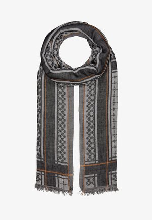 Lange zwarte en grijze sjaal met geometrische sterpatronen, oranje strepen en franjes aan de uiteinden, opgevouwen in een cirkelvormige lus.