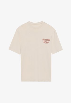 Bežna bombažna majica s kratkimi rokavi, okroglo izrezana, z rdečim grafičnim napisom "Lepo zlomljena" na levem predelu prsi.