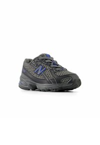 Black athletic shoe with mesh material, grey accents, blue logo, and textured rubber sole; features laces and padded collar for support.