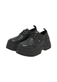 Scarpe nere chunky con plateau, stringate, suole spesse e linguette al tallone, mostrate da fronte e lato.