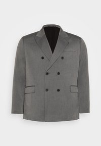 Dubbelknäppt grå blazer i strukturerat tyg, med svarta knappar, snedställda slag, två framfickor och en elegant inre foder.