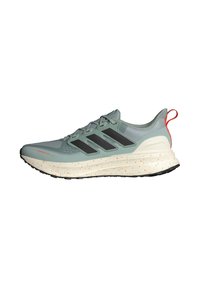 Svetlozelená bežecká obuv s čiernymi pruhmi, textúrovaný zvršok, biela medzipodrážka s oranžovými škvrnami a čierna gumová podošva.