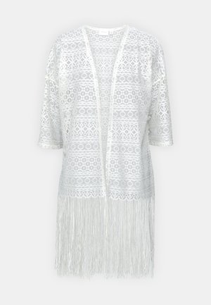 Cardigan bianco in pizzo con motivi elaborati, apertura frontale, maniche corte e dettagli in frange all'orlo.