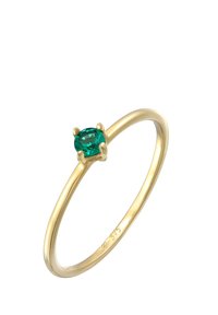 Goldring mit einem glatten, dünnen Band und einem zentralen ovalen grünen Edelstein, der von abgerundeten Krallen sicher gehalten wird.