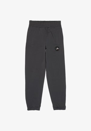 Pantalon noir à taille élastique avec une coupe effilée, doté de poches latérales et d'un écusson circulaire sur la cuisse gauche. Texture de tissu lisse.