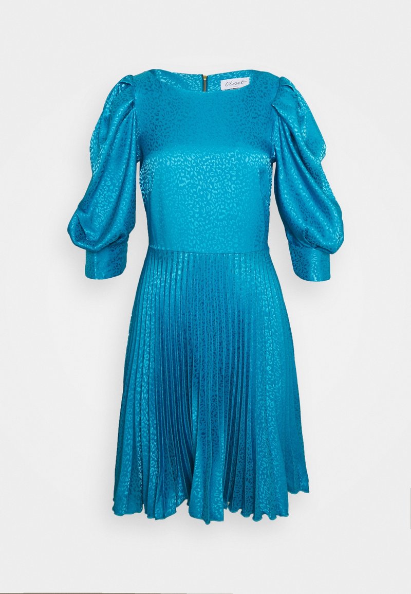 Robe courte à manches courtes de couleur sarcelle avec un motif léopard texturé, jupe plissée et manches bouffantes. Dotée d'une fermeture éclair au dos et d'un corsage ajusté.