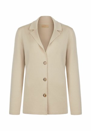 Beige strikket blazer med en klapkrave, præget af fire brune knapper og lange ærmer, lavet af blødt, tekstureret stof.