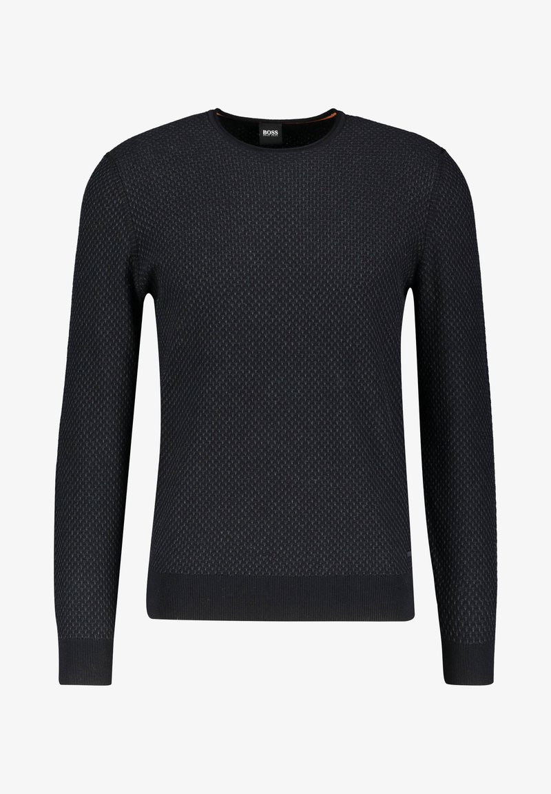 Pull en laine bleu marine avec un col rond, des manches longues, un motif texturé et des poignets et un ourlet côtelés. Étiquette de la marque visible.