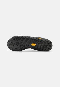 Vibram rubber sole with a textured, black finish; features a geometric pattern with a textured surface for traction and durability.