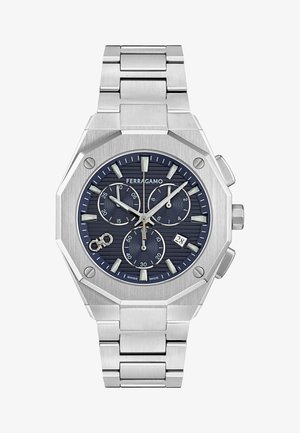 Reloj cronógrafo de acero inoxidable plateado con caja octagonal, esfera texturada en color azul marino, acentos plateados y función de fecha a las 6 en punto.