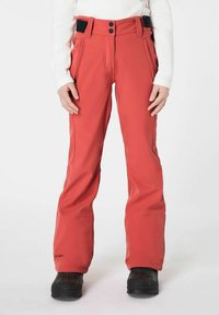 Rote Schnee-Hose mit taillierter Passform, aus strapazierfähigem Material. Verfügt über zwei vordere Taschen, einen verstellbaren Bund und dezente Beinapplikationen.