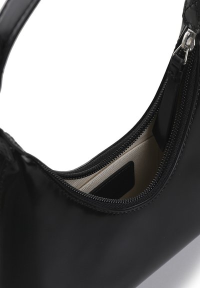 Black handbag featuring a smooth, shiny exterior, zippered closure, and beige interior lining with a pocket. Compact and sleek design.