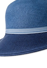 Blue straw hat featuring a textured surface, a wide brim, and a light blue and white striped band around the crown.