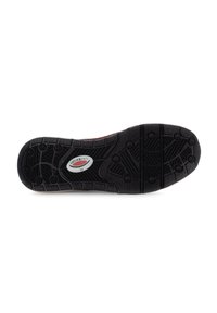 Black rubber shoe sole with textured grip patterns, featuring a circular logo in white and red. Designed for traction and durability.